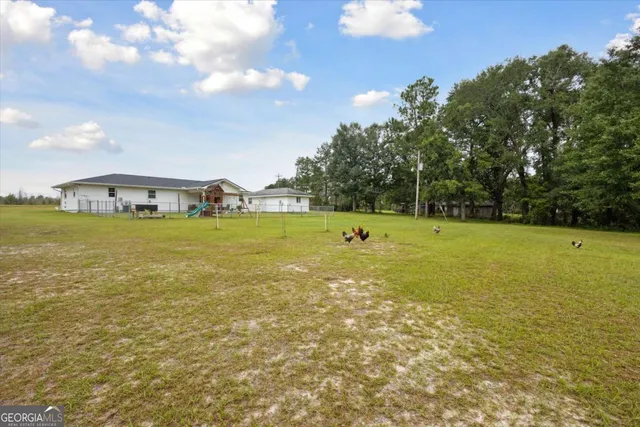 a view of a golf course with a swimming pool