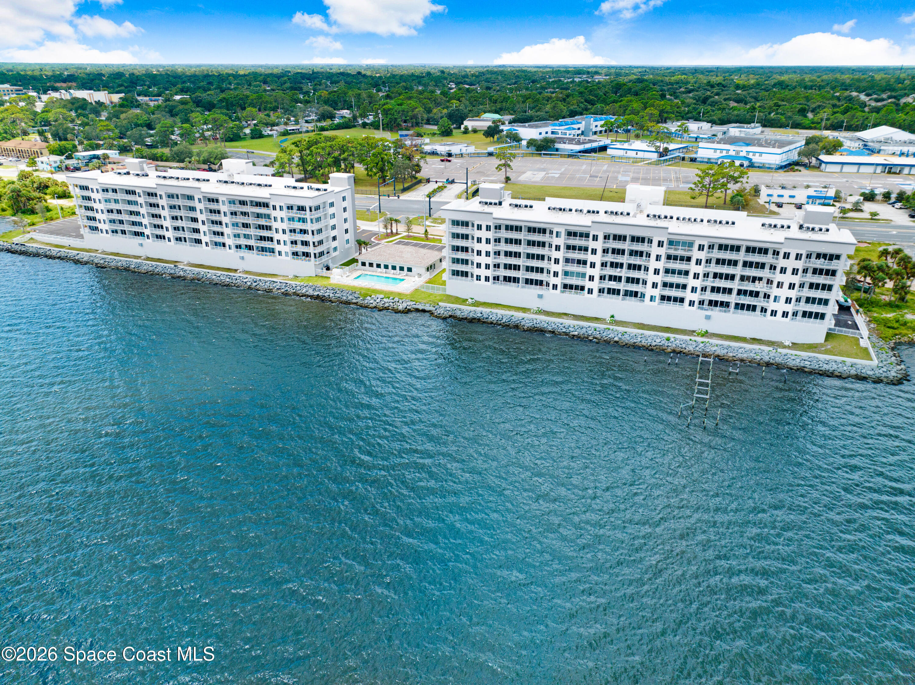 1805 Riverside Drive, Unit 304 Titusville, FL 32780 - Photo 6 of 46 a view of a city and an ocean view