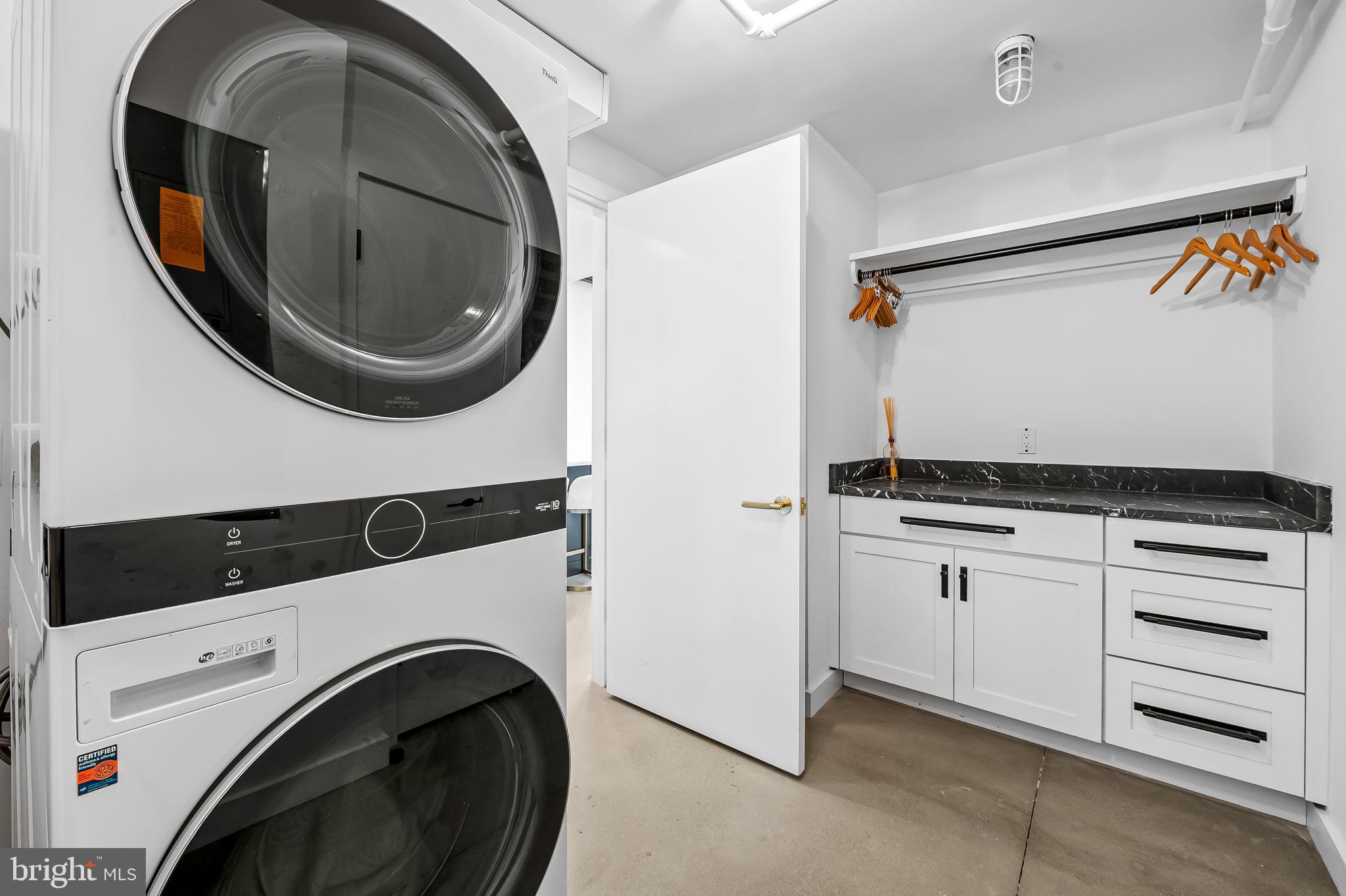 1220 Bank Street, Unit 304 Baltimore, MD 21202 - Photo 71 of 81 a utility room with dryer and washer