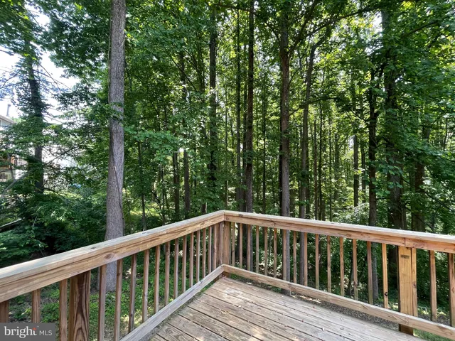 a view of balcony with deck and trees