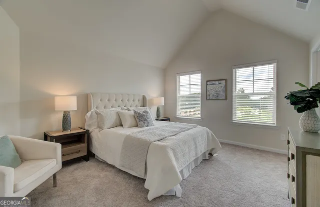 a bedroom with a bed and a dresser in it