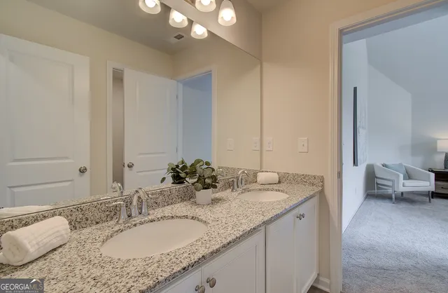 a white toilet sitting next to a bath tub