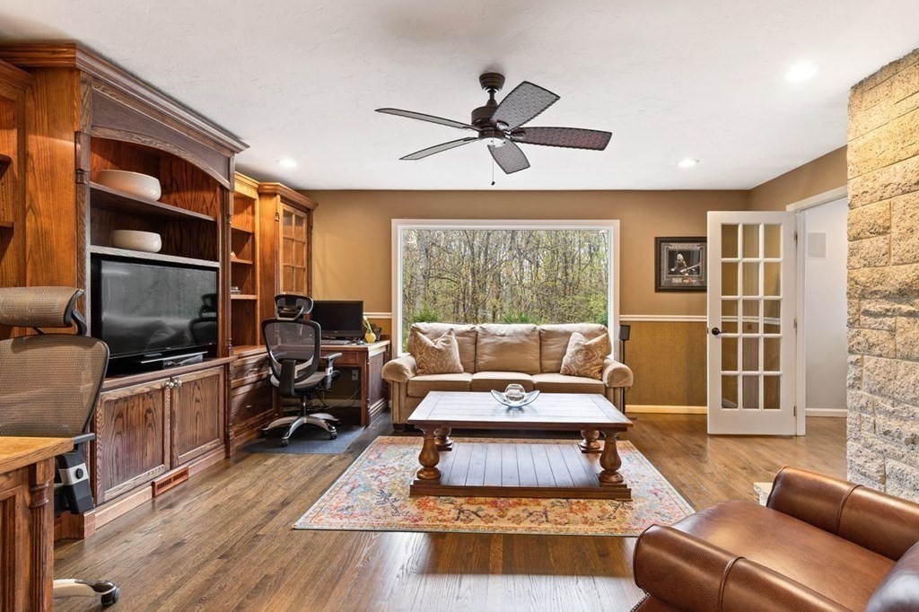 7 Kings Road Sharon, MA 02067 - Photo 21 of 41 a living room with furniture or couch and a flat screen tv