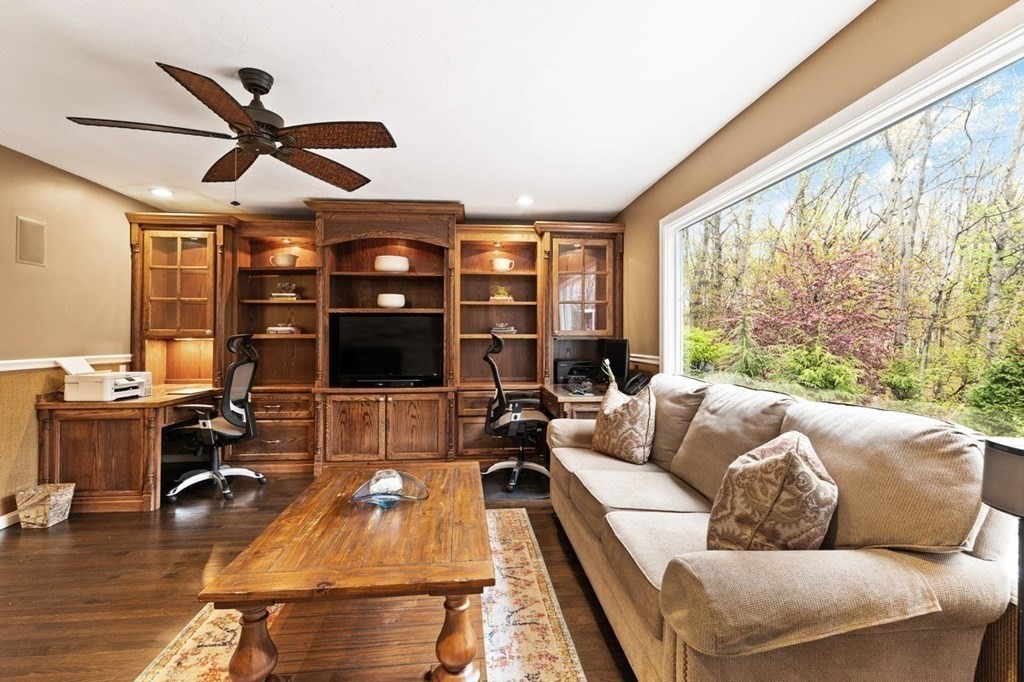 7 Kings Road Sharon, MA 02067 - Photo 22 of 41 a living room with furniture a ceiling fan and a large window