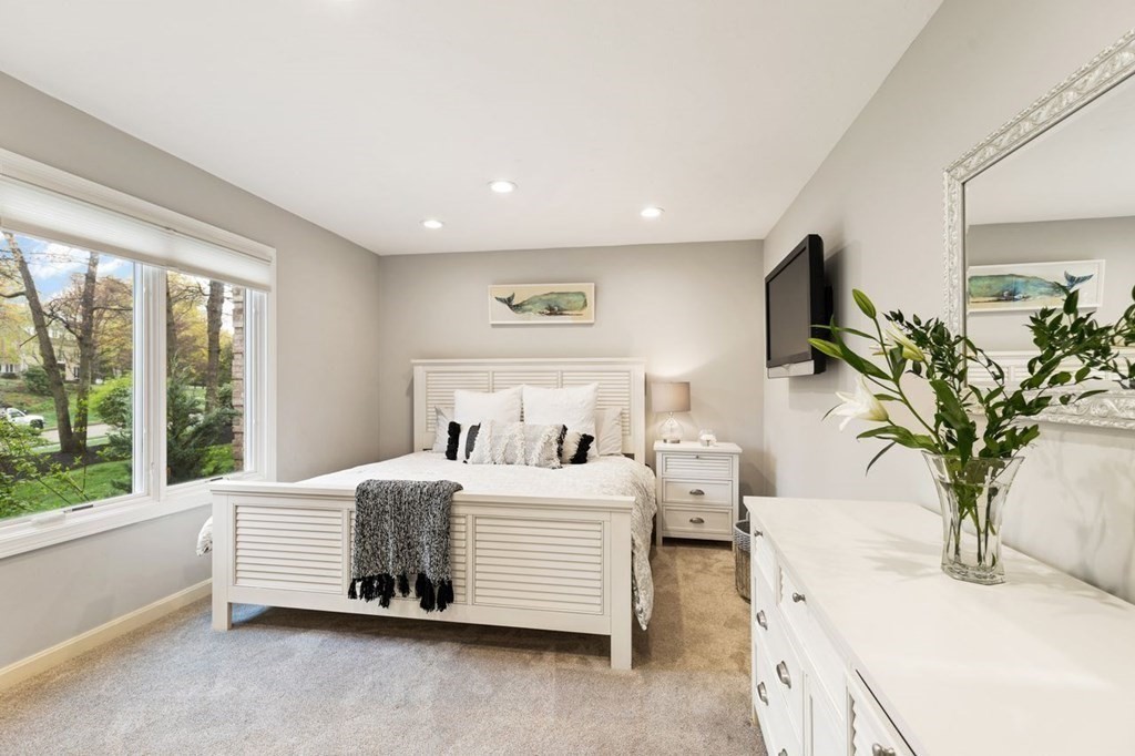 7 Kings Road Sharon, MA 02067 - Photo 23 of 41 a bedroom with a large bed and a potted plant