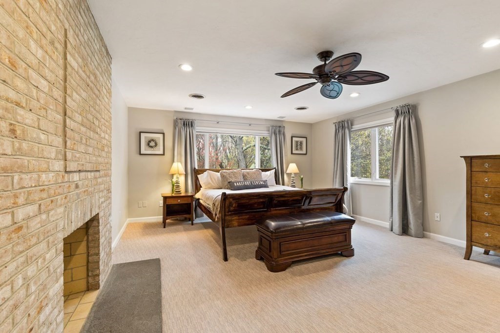 7 Kings Road Sharon, MA 02067 - Photo 26 of 41 a living room with furniture and a fireplace