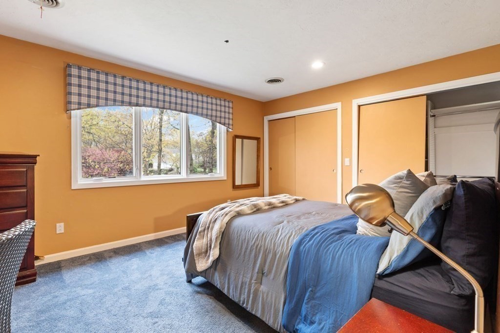 7 Kings Road Sharon, MA 02067 - Photo 30 of 41 a bed sitting in a room next to a window