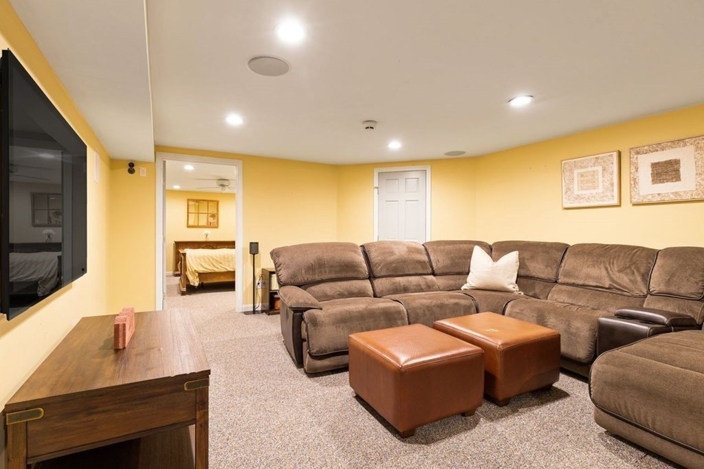 7 Kings Road Sharon, MA 02067 - Photo 34 of 41 a living room with furniture and a flat screen tv