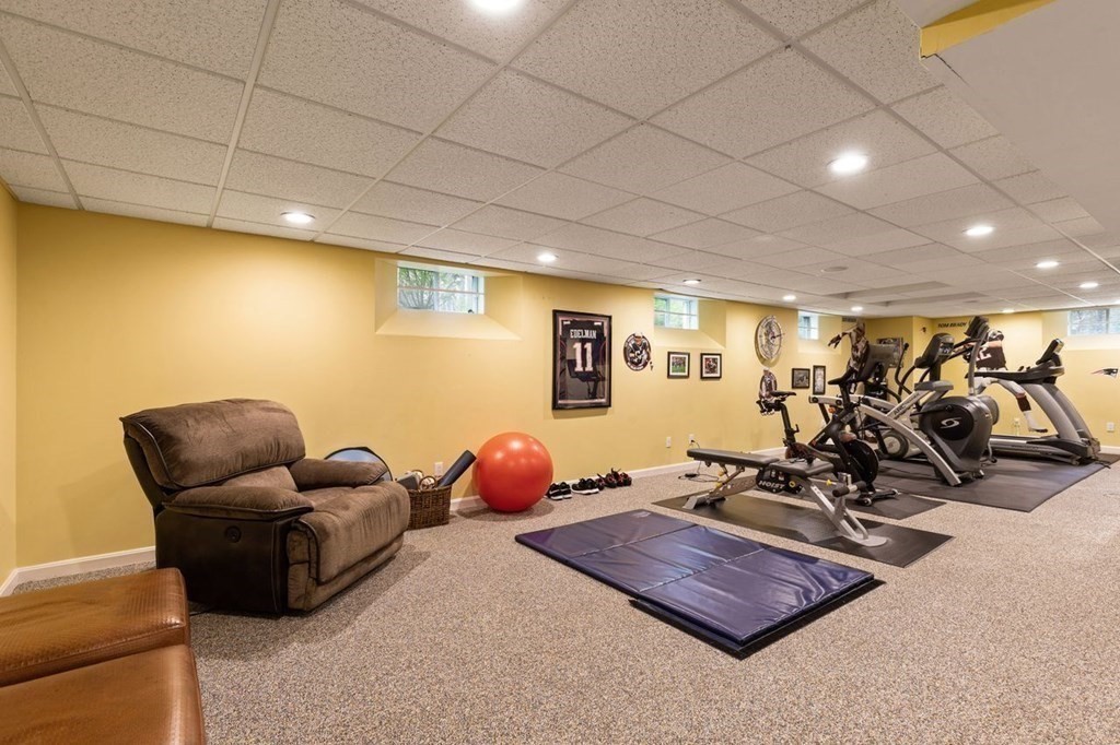 7 Kings Road Sharon, MA 02067 - Photo 35 of 41 a room with gym equipment and a table