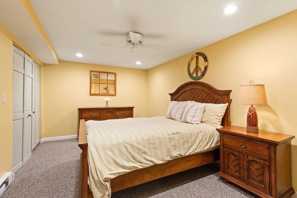 7 Kings Road Sharon, MA 02067 - Photo 36 of 41 a bedroom with a bed and lamp with window