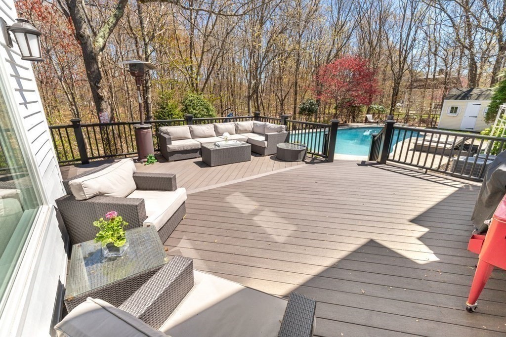 7 Kings Road Sharon, MA 02067 - Photo 37 of 41 a view of a patio with couches chairs and wooden floor