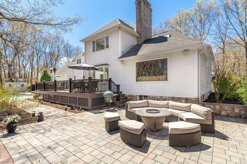 7 Kings Road Sharon, MA 02067 - Photo 39 of 41 a view of a patio with couches table and chairs and potted plants