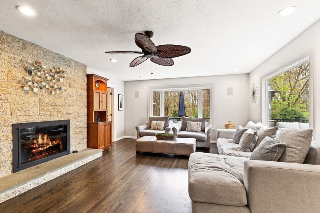 7 Kings Road Sharon, MA 02067 - Photo 5 of 41 a living room with furniture a fireplace and a large window