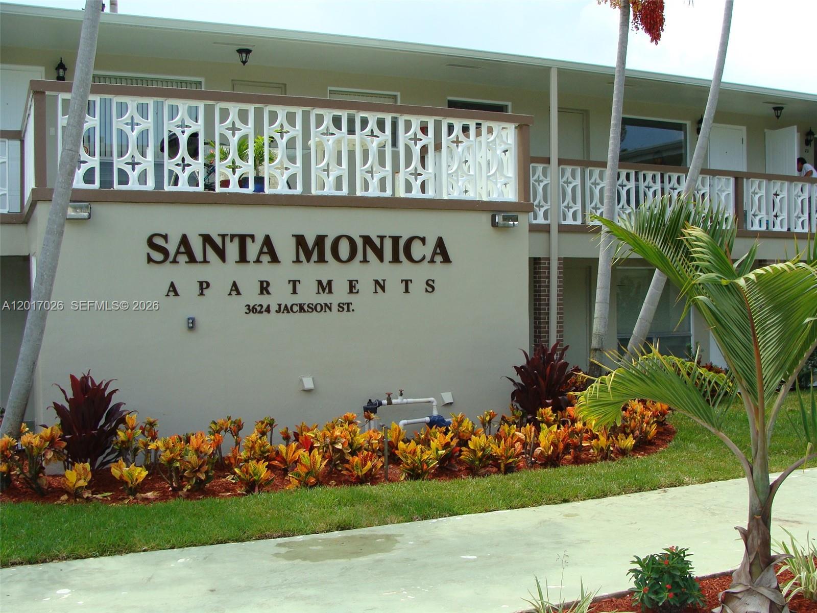 3624 Jackson Street, Unit 2 Hollywood, FL 33021 - Photo 2 of 10 a view of a bunch of flowers in front of house