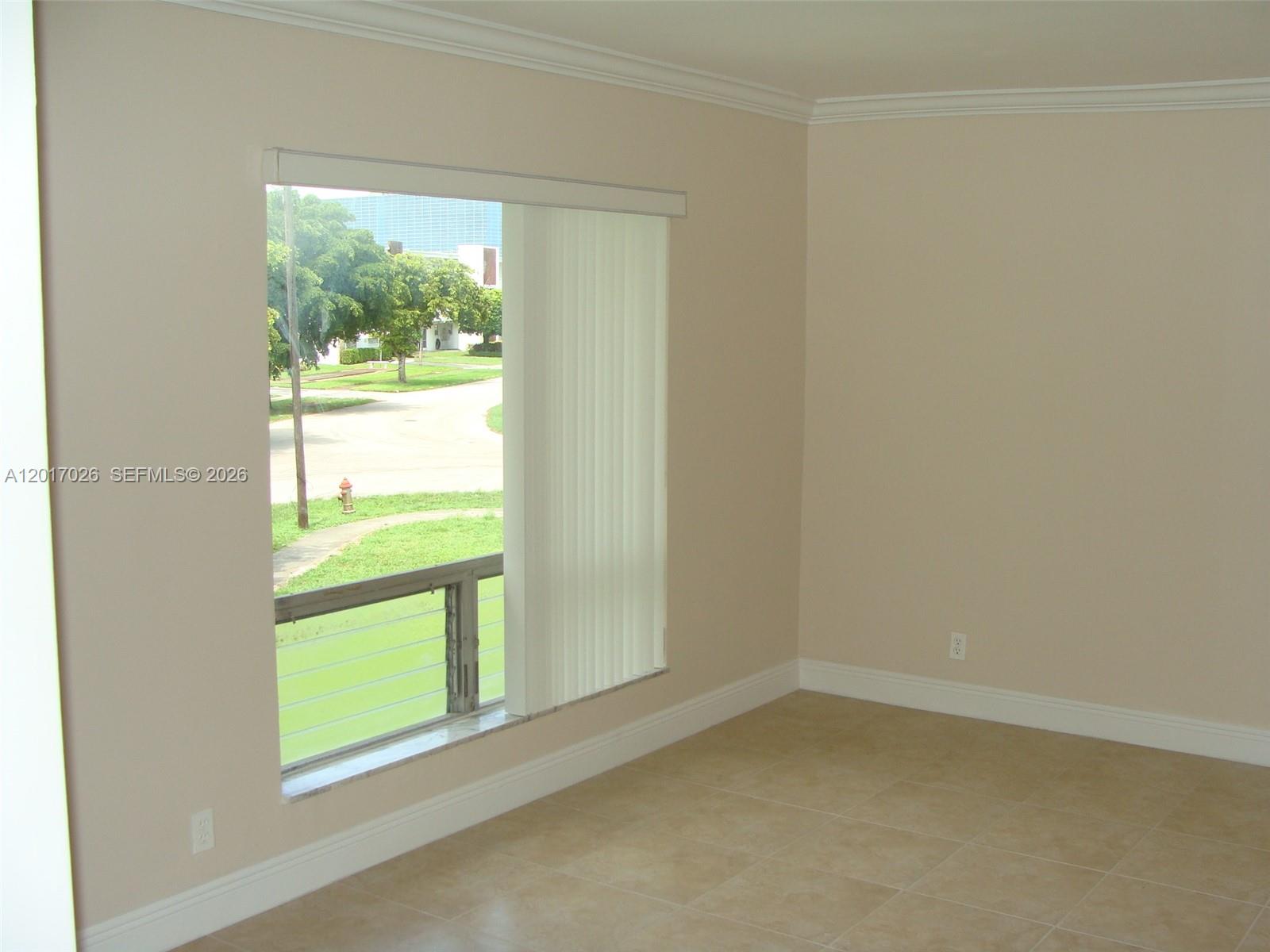 3624 Jackson Street, Unit 2 Hollywood, FL 33021 - Photo 6 of 10 an empty room with a window