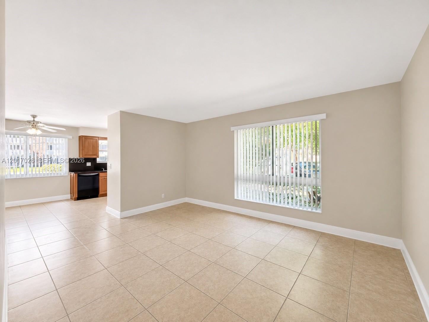 3624 Jackson Street, Unit 2 Hollywood, FL 33021 - Photo 7 of 10 a view of an empty room with a kitchen