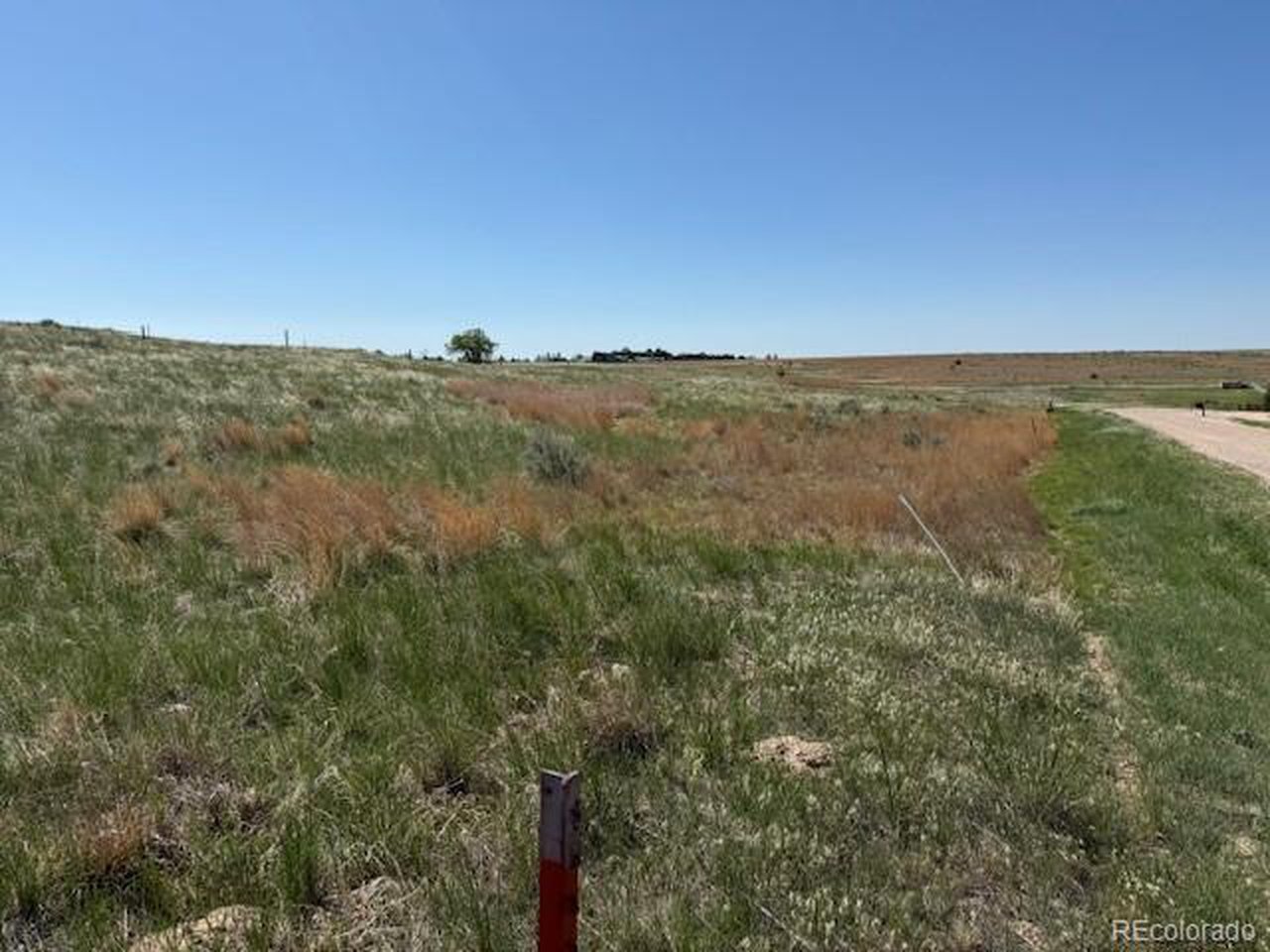 36 Arlyn Way Wray, CO 80758 - Photo 2 of 16 a view of a field with an ocean and mountain view