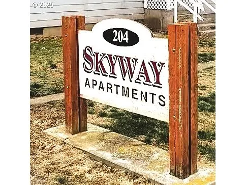 a sign broad on a brick wall