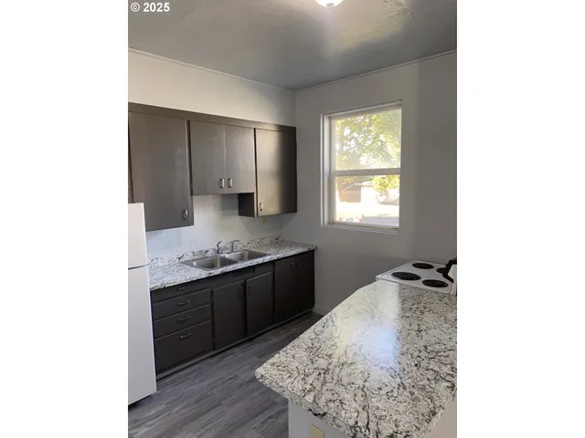 a room with a sink and a mirror