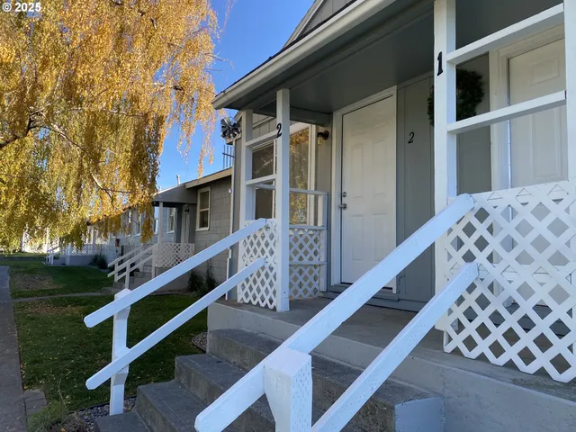 a brick house with a yard