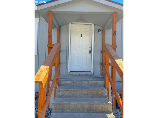 a view of room with window and hardwood