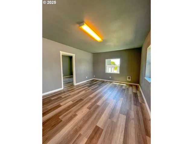 a bathroom with a sink mirror vanity and toilet