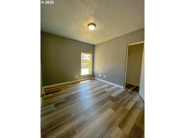 a bathroom with a double vanity sink toilet mirror and bathtub
