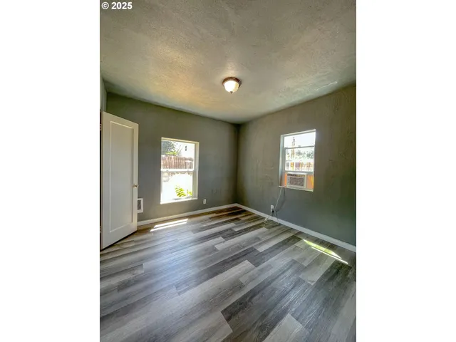 a room with a sink and cabinets