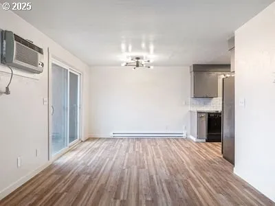 a view of a livingroom with wooden floor