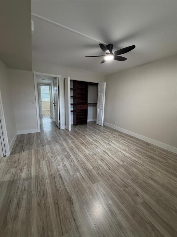 6300 Northwest 2nd Avenue, Unit 206 Boca Raton, FL 33487 - Photo 11 of 16 wooden floor in an empty room with a window