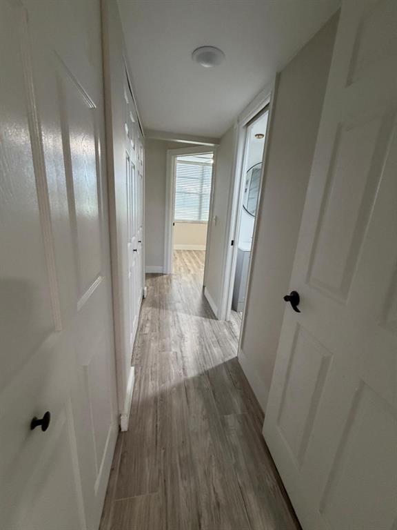 6300 Northwest 2nd Avenue, Unit 206 Boca Raton, FL 33487 - Photo 13 of 16 a view of a hallway with wooden floor