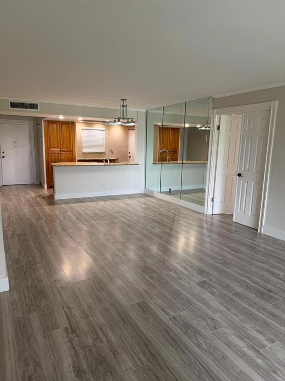 6300 Northwest 2nd Avenue, Unit 206 Boca Raton, FL 33487 - Photo 3 of 16 a view of empty room with wooden floor