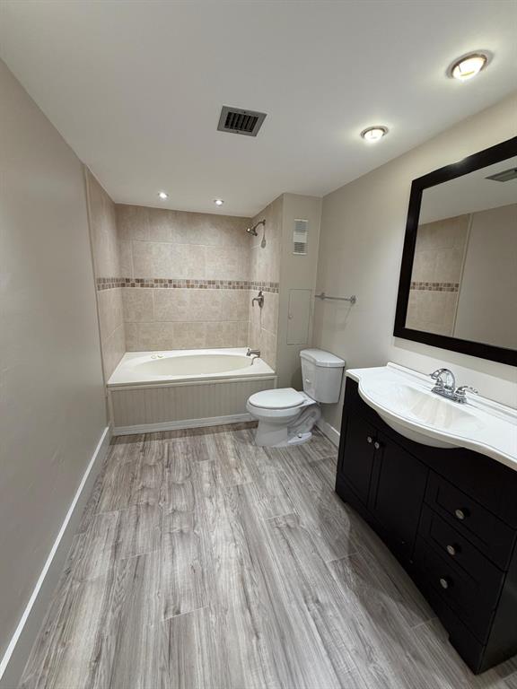 6300 Northwest 2nd Avenue, Unit 206 Boca Raton, FL 33487 - Photo 7 of 16 a bathroom with a sink and a mirror