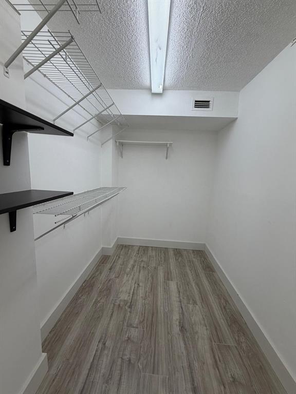 6300 Northwest 2nd Avenue, Unit 206 Boca Raton, FL 33487 - Photo 10 of 16 a view of a room with wooden floor