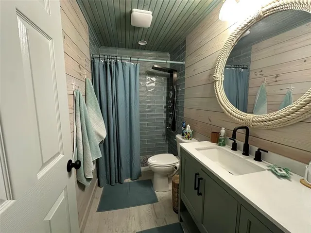 a reading room with furniture and a chair