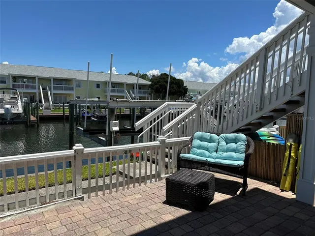 a view of swimming pool with a yard and lake view