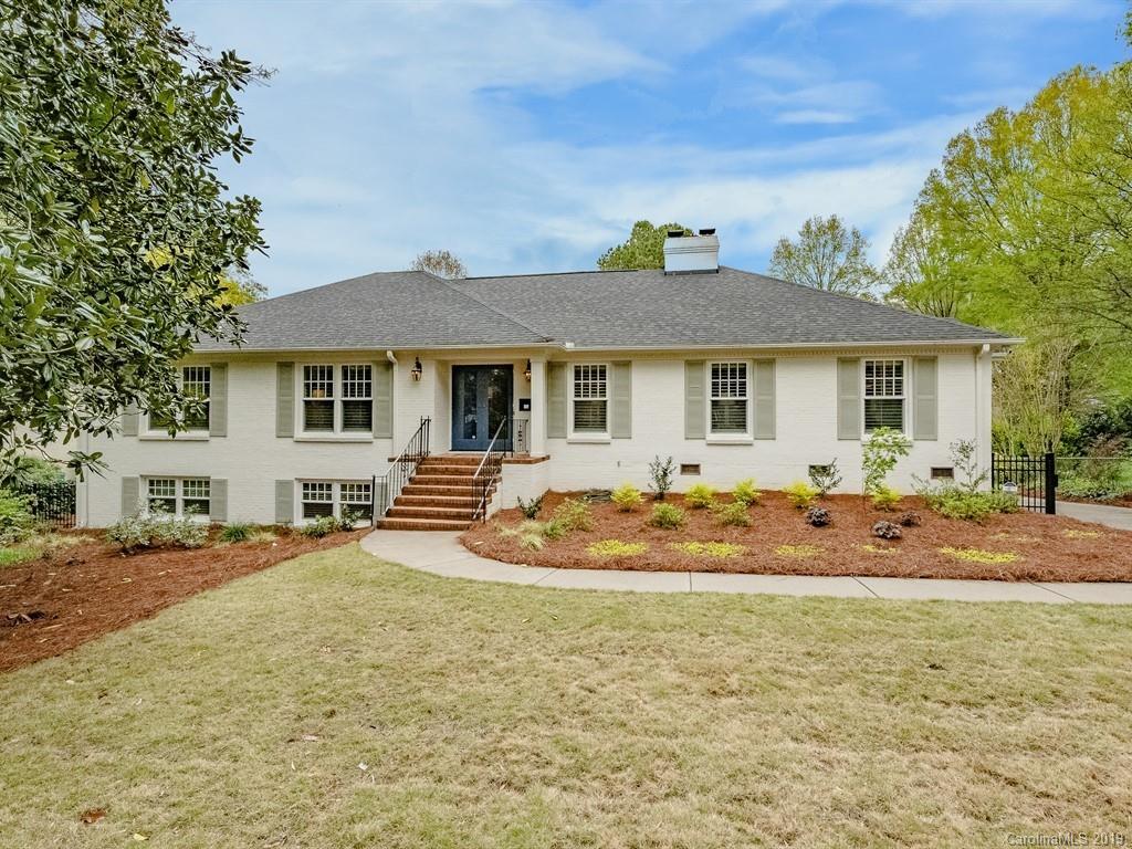 3110 Ferncliff Road Charlotte, NC 28211 - Photo 1 of 41 a backyard of a house with table and chairs under an umbrella