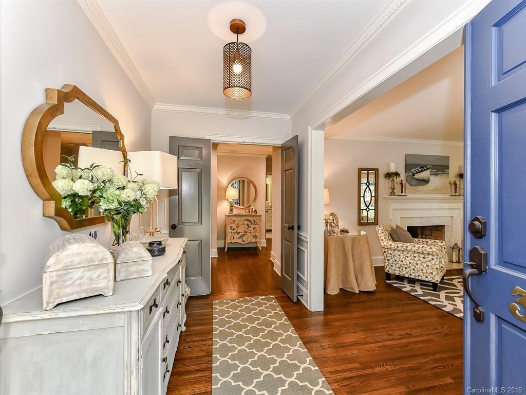 3110 Ferncliff Road Charlotte, NC 28211 - Photo 2 of 41 a hallway with fireplace and chandelier
