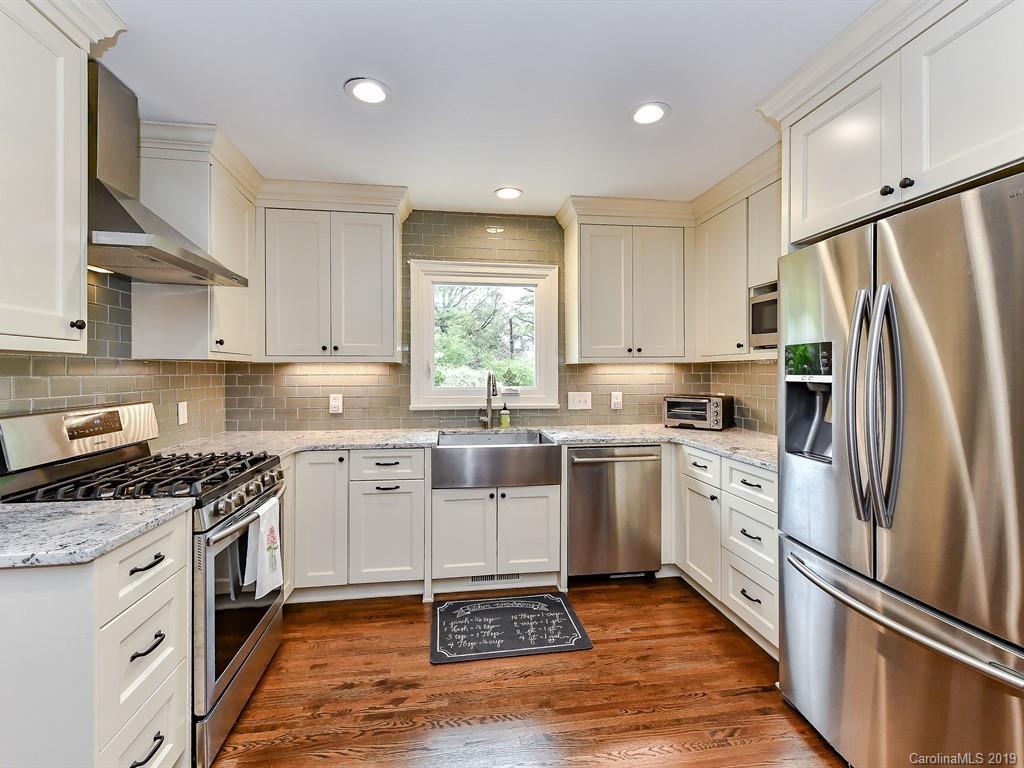 3110 Ferncliff Road Charlotte, NC 28211 - Photo 11 of 41 a kitchen with white cabinets stainless steel appliances and a window