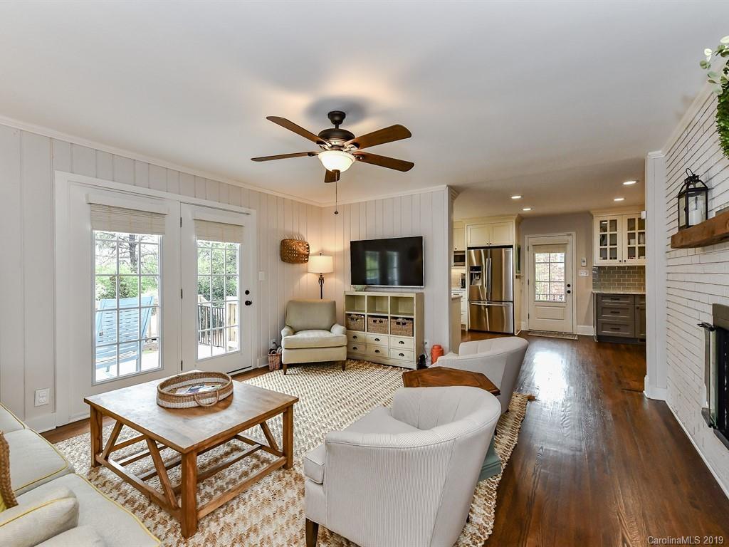3110 Ferncliff Road Charlotte, NC 28211 - Photo 15 of 41 a living room with furniture a flat screen tv and a fireplace