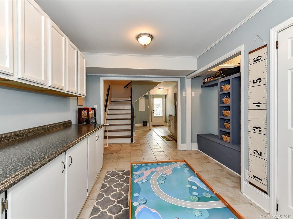 3110 Ferncliff Road Charlotte, NC 28211 - Photo 28 of 41 a kitchen with stainless steel appliances granite countertop a sink and cabinets