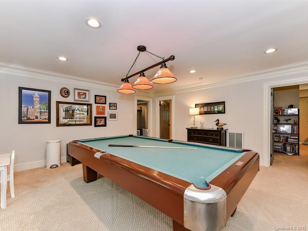 3110 Ferncliff Road Charlotte, NC 28211 - Photo 31 of 41 a room with table chairs and a flat screen tv