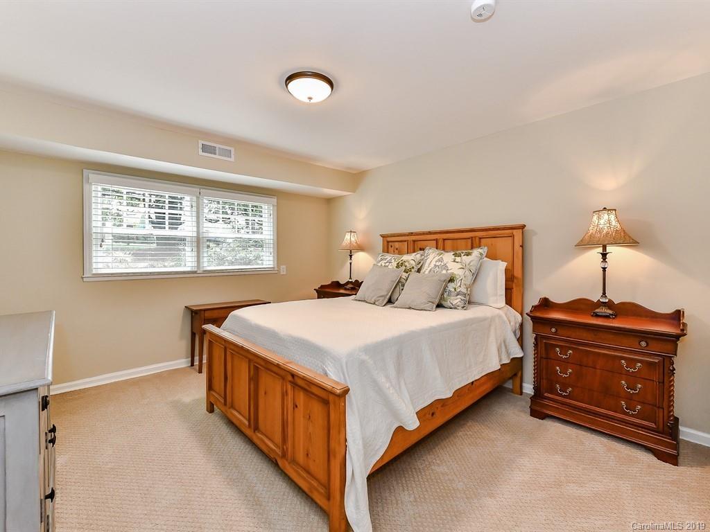 3110 Ferncliff Road Charlotte, NC 28211 - Photo 32 of 41 a bed sitting in a bedroom next to a window