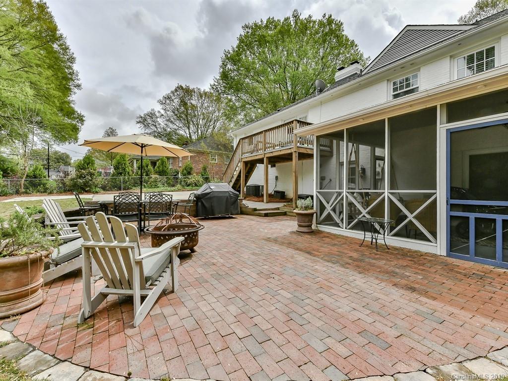 3110 Ferncliff Road Charlotte, NC 28211 - Photo 37 of 41 a view of a patio with a table and chairs under an umbrella