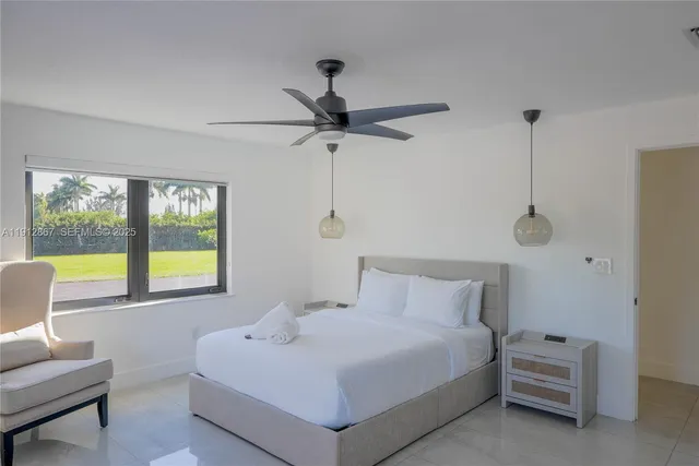 a bedroom with a bed and a couch