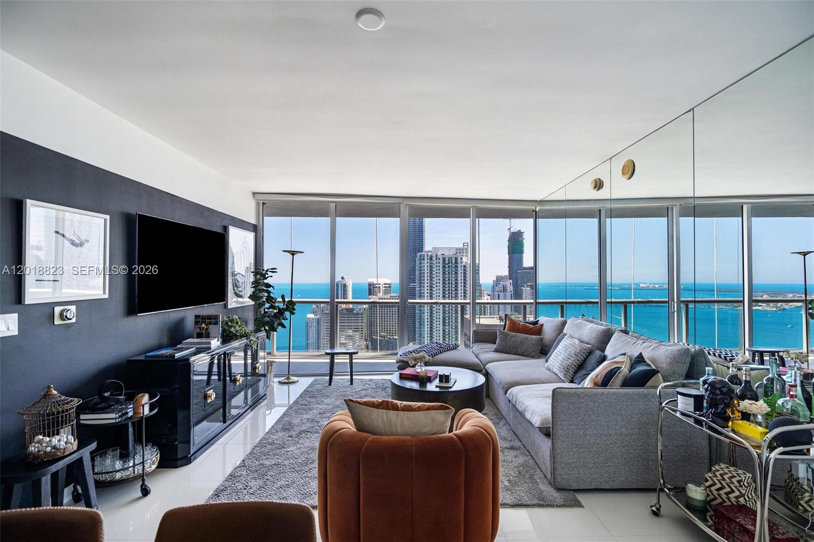 495 Brickell Avenue, Unit 4911 Miami, FL 33131 - Photo 1 of 35 a living room with furniture and a flat screen tv