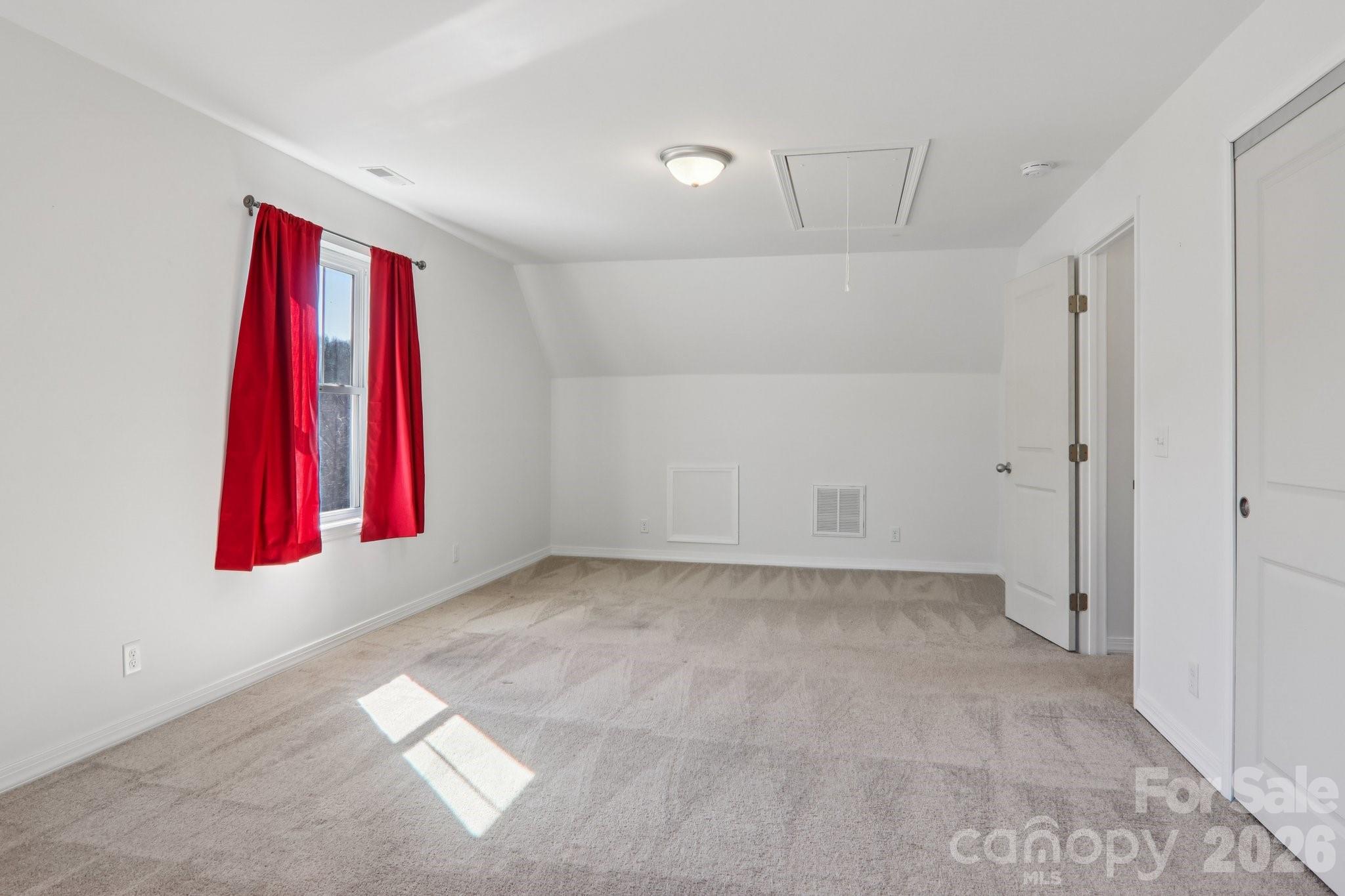 751 Hutch Mountain Road Fletcher, NC 28732 - Photo 30 of 48 a view of a room with window and a ceiling fan