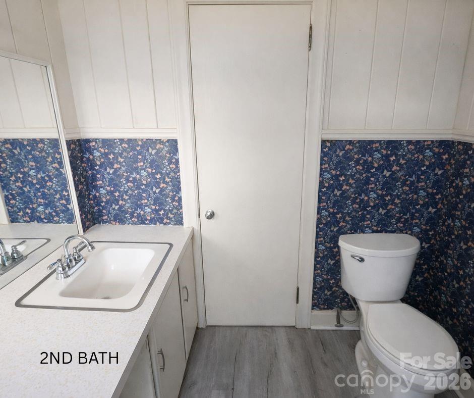 7362 Hull Road Cherryville, NC 28021 - Photo 14 of 22 a bathroom with a toilet sink and mirror