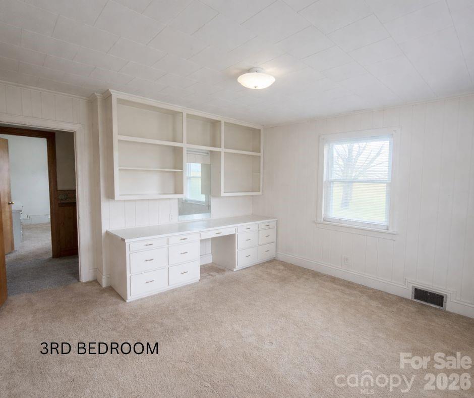 7362 Hull Road Cherryville, NC 28021 - Photo 16 of 22 an empty room with windows and cabinet