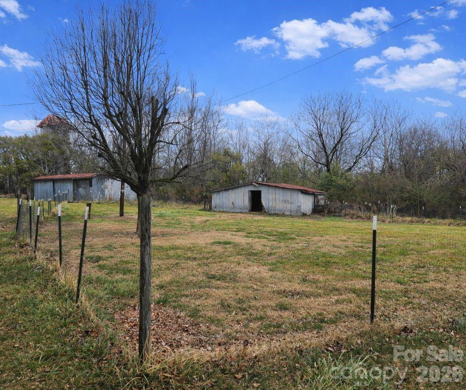 7362 Hull Road Cherryville, NC 28021 - Photo 21 of 22 a view of a yard with a tree